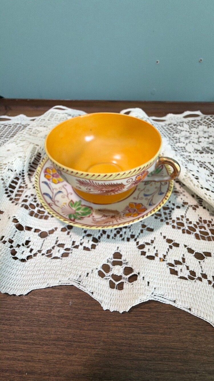 #81 vintage Japanese porcelain teacup and saucer with yellow interior and hand-p